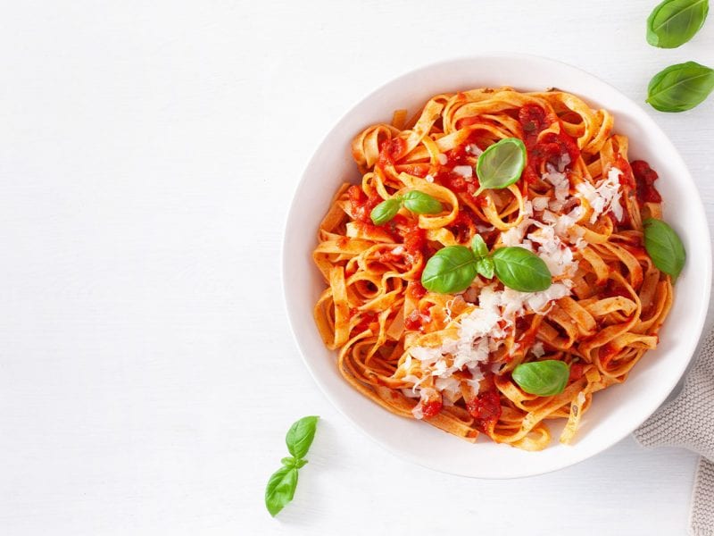 A big bowl of Arrezzio Italian pasta with tomato sauce and basil.