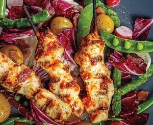 Bacon-Basted Chicken Breast Skewers Over Spring Salad