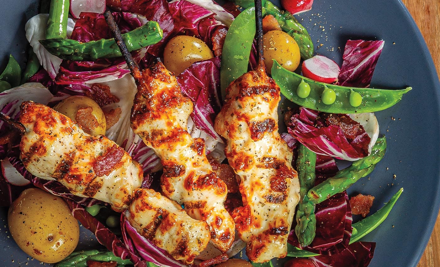 Bacon-Basted Chicken Breast Skewers Over Spring Salad