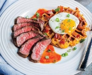 Steak and Egg-Topped Sweet Potato Hash Waffle Over Bourbon-Chile Glaze