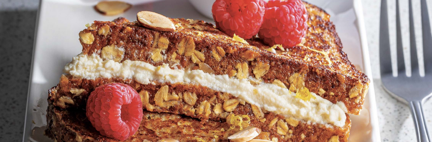 lemon ricotta stuffed french toast with oat, raspberries and a coffee