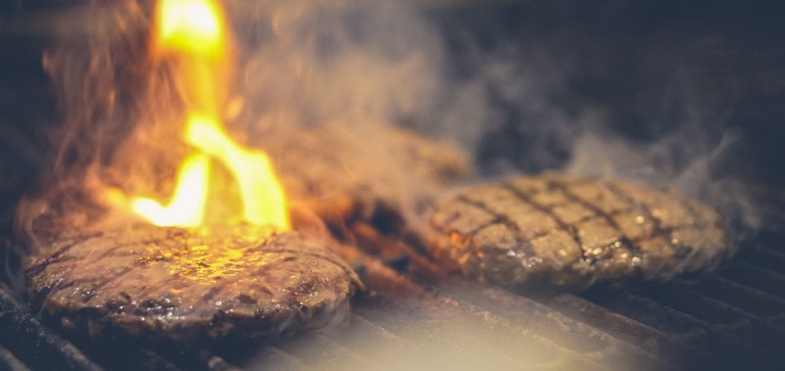 Burger patties on the grill at Foxfire restaurant