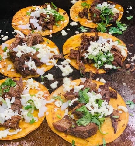 Barbacoa tacos preparation - Melecios Authentic Mexican Restaurant