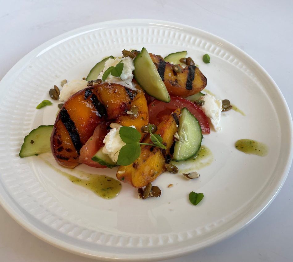 Grilled peaches with pepitas